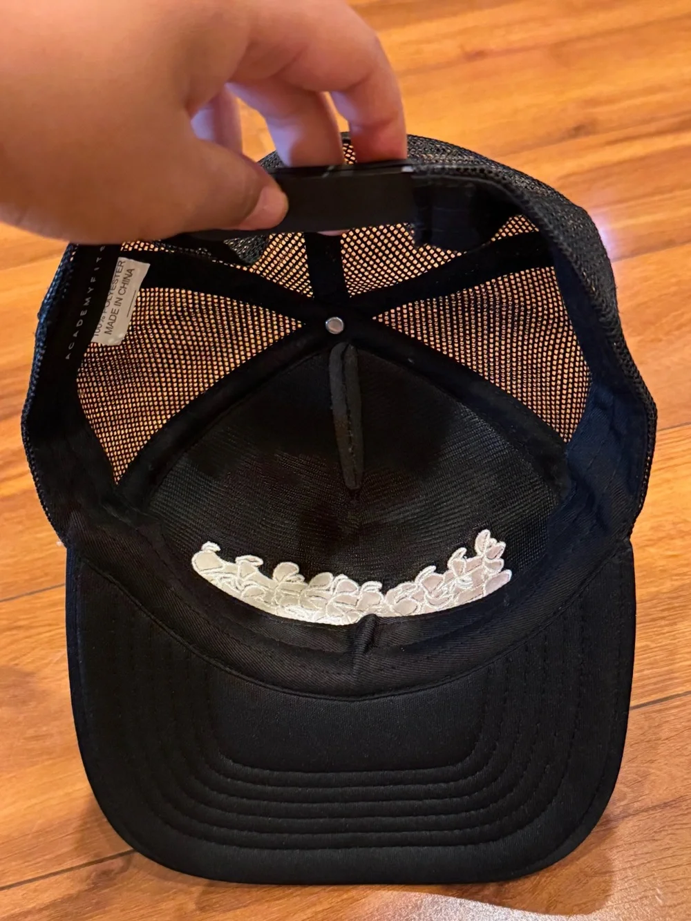 Black Trucker Hat with White Puakenikeni Flowers